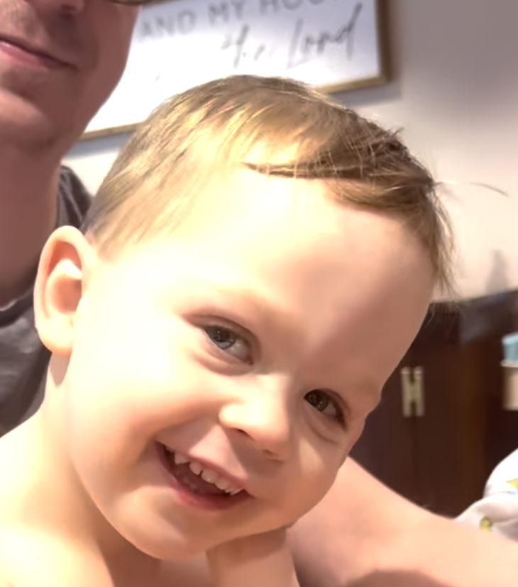 Finley listening to his personalized song made with FinleySong